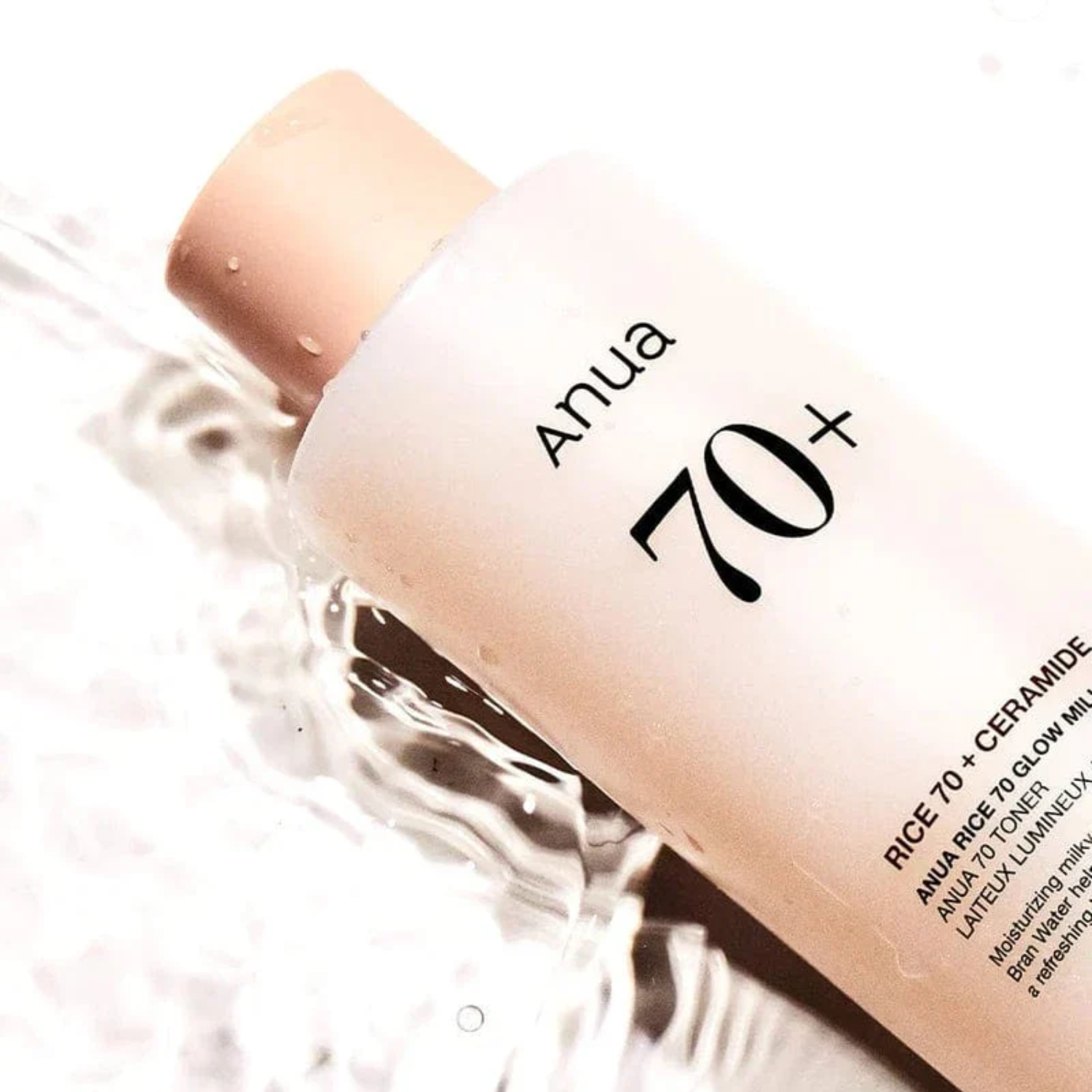 Anua 70+ skincare product with a applicator on a white background