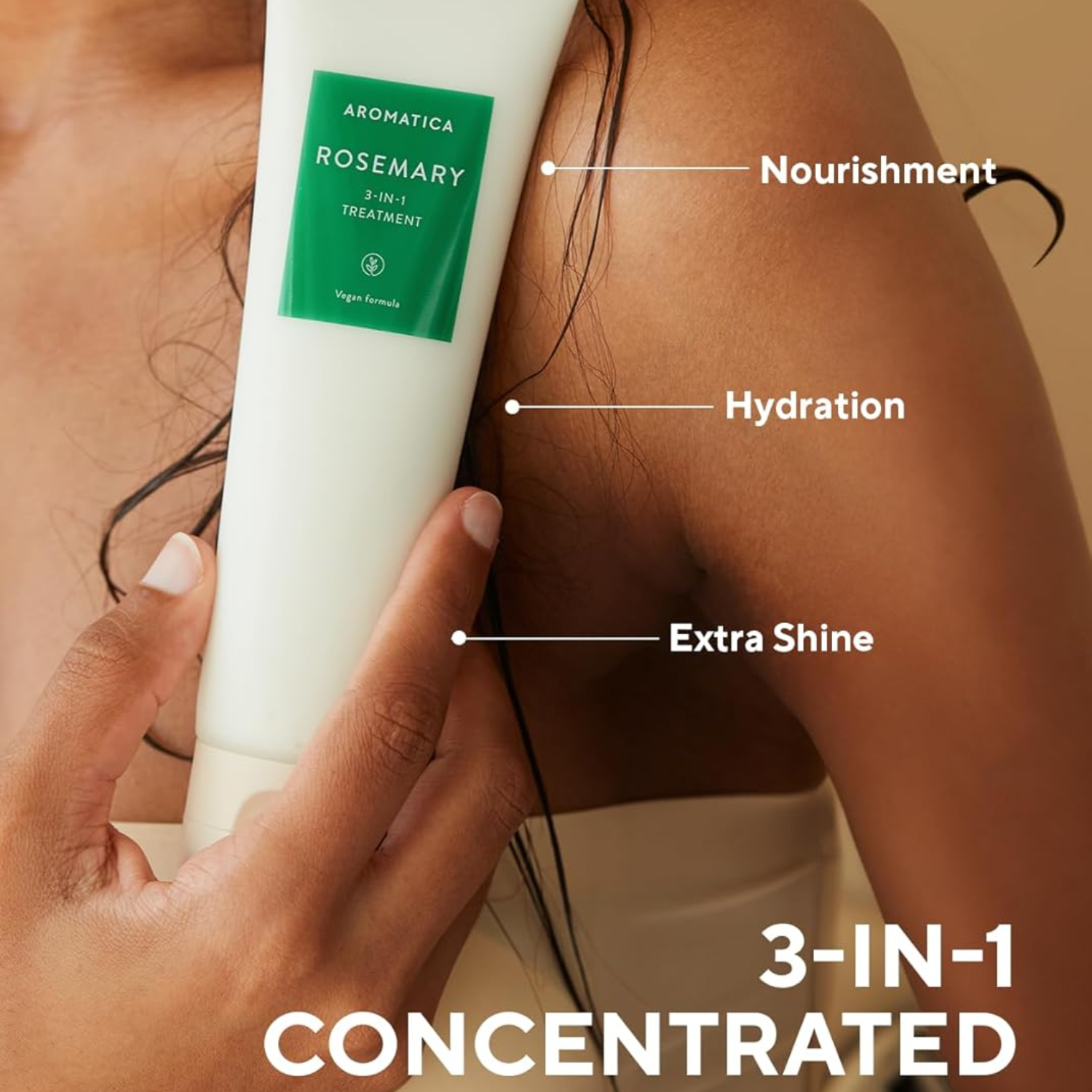 Hand holding a 3-in-1 concentrated treatment bottle labeled for nourishment, hydration, and extra shine.