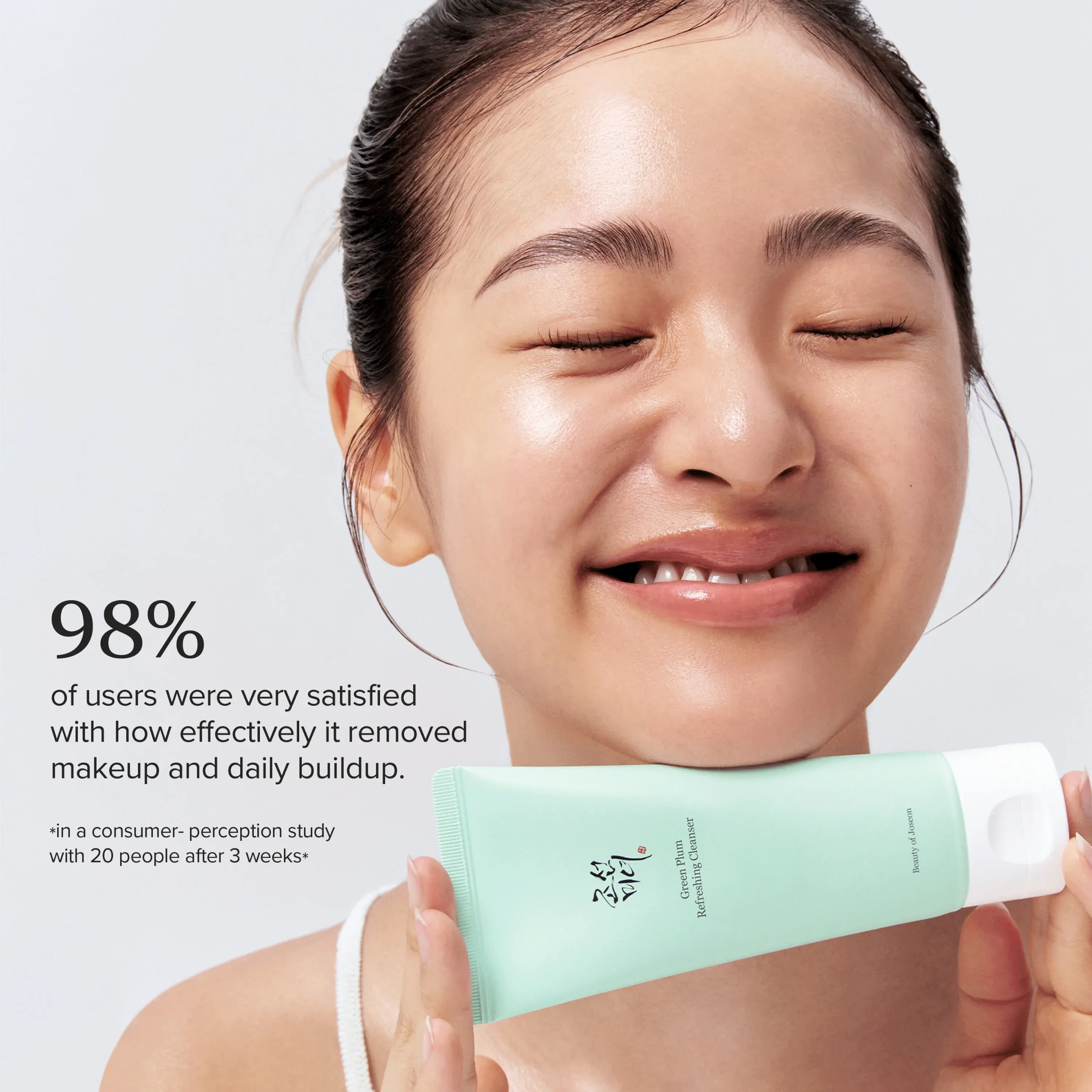 Woman holding a skincare product with text about user satisfaction.