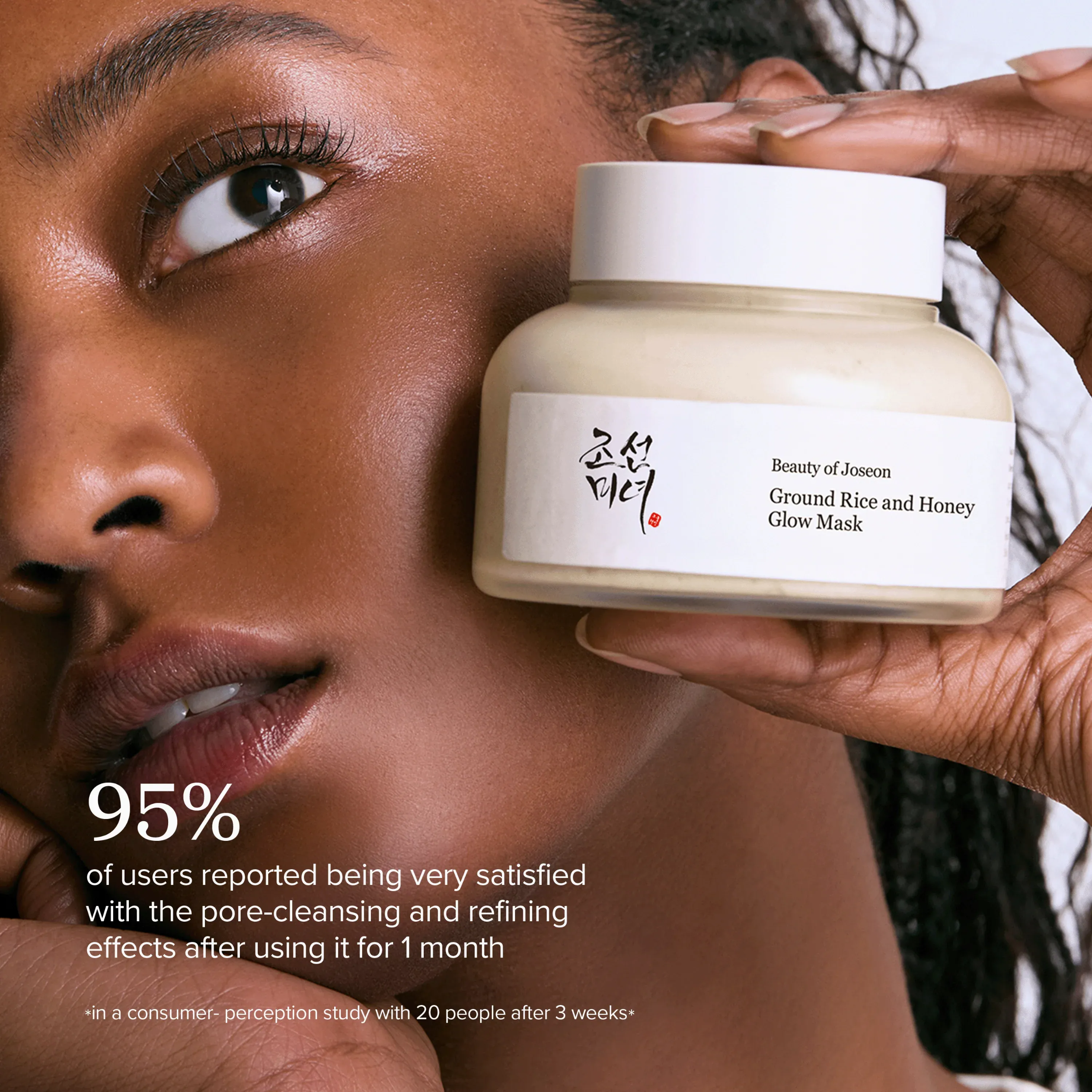 Person holding a jar of Beauty of Joseon Ground Rice and Honey Glow Mask with text on satisfaction.