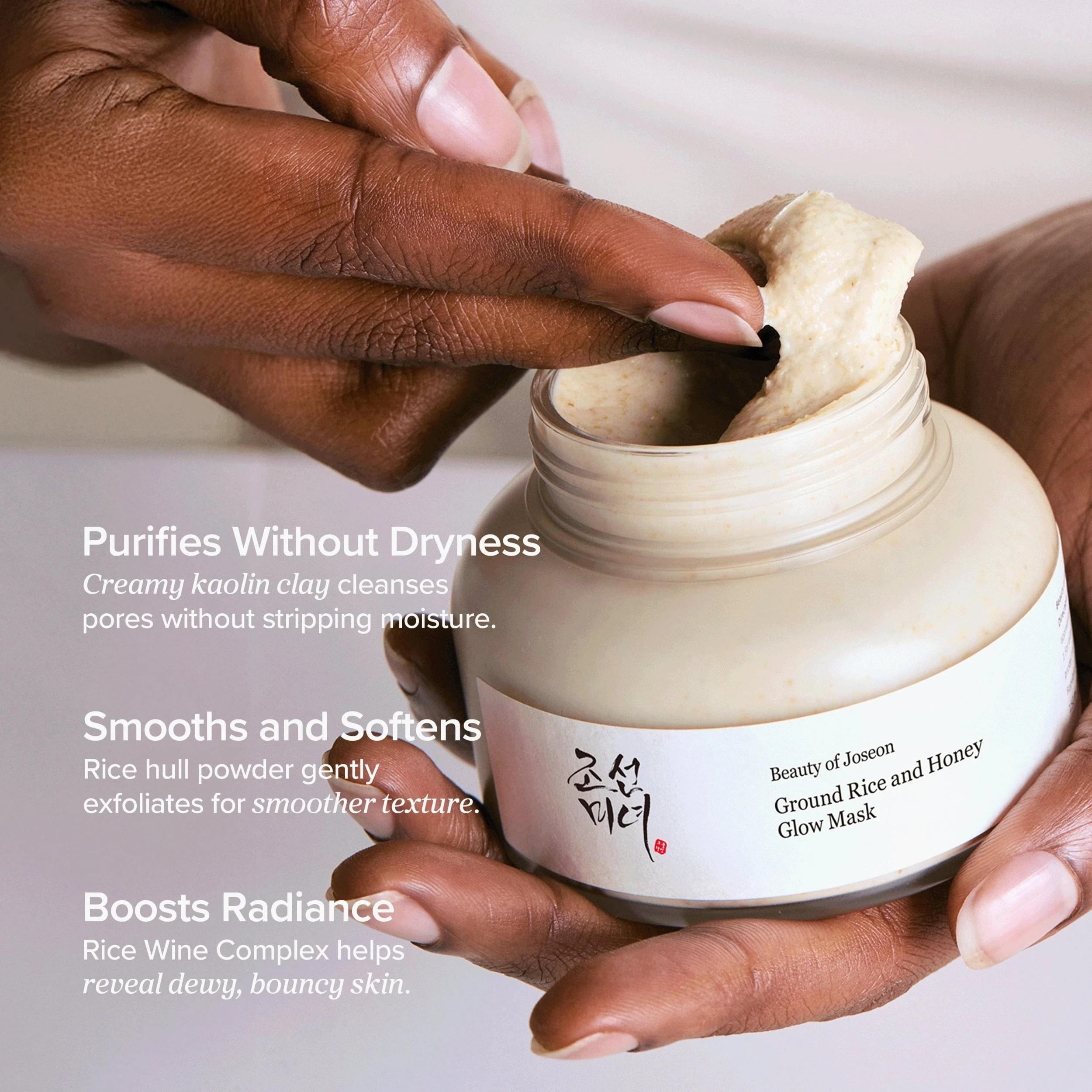 Hand opening a jar of Beauty of Joseon Ground Rice and Honey Glow Mask with product description text.