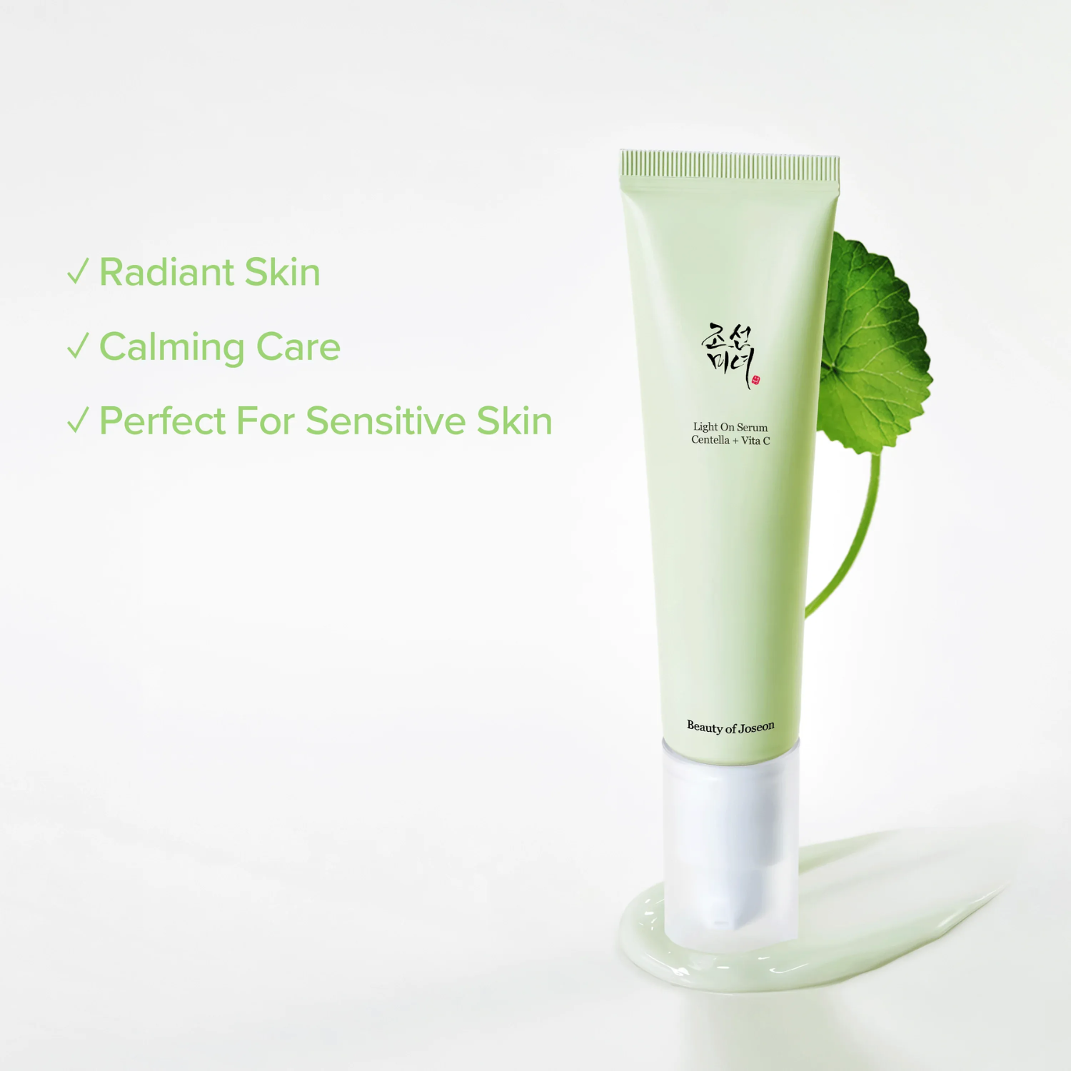 Skincare product with green leaf on a white background