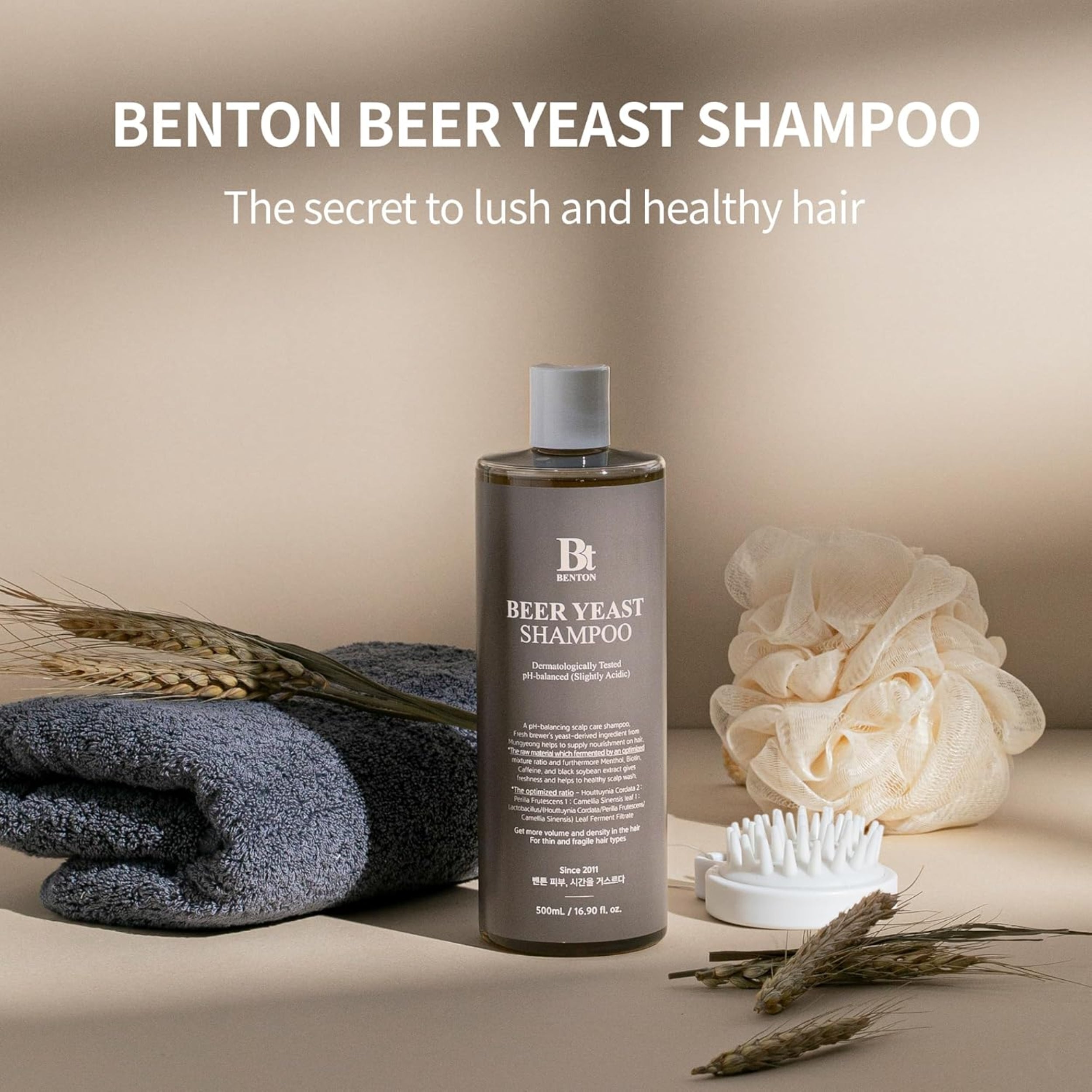 Benton Beer Yeast Shampoo bottle with accessories on a neutral background