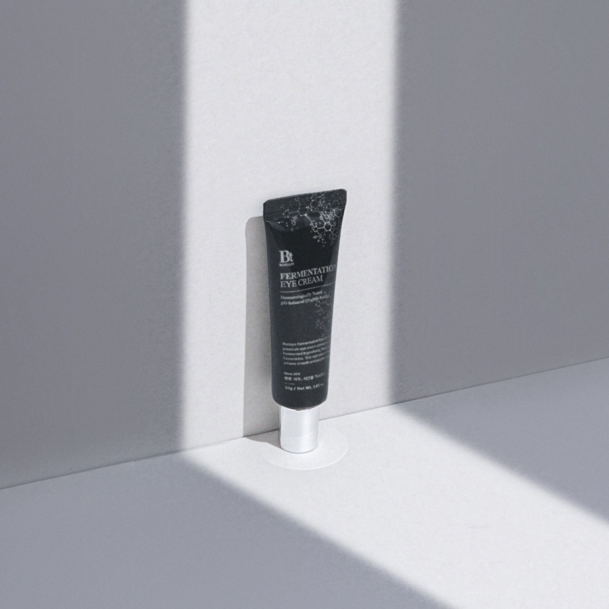 Skincare tube on a light gray background