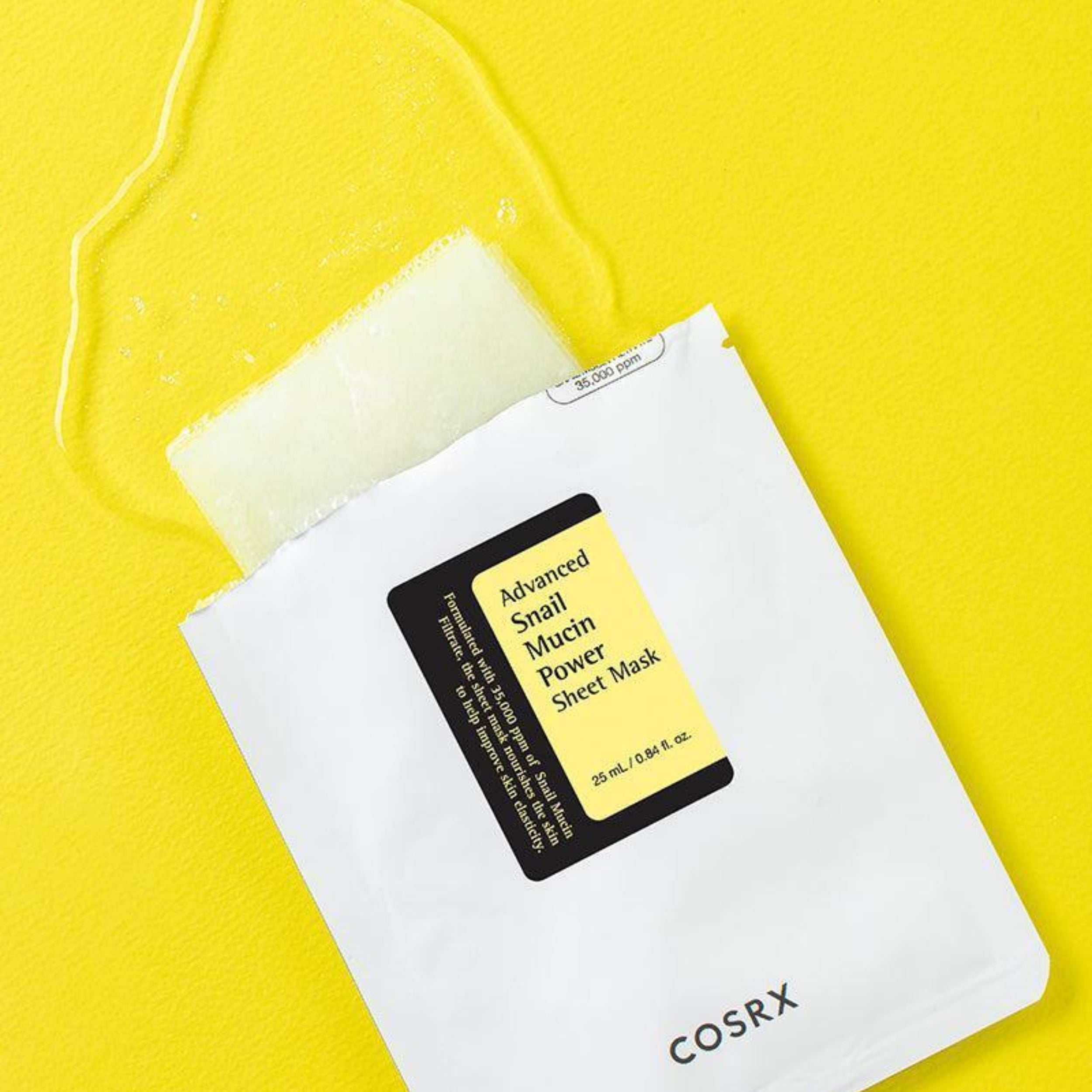 COSRX Advanced Snail Mucin Power Sheet Mask on a yellow background