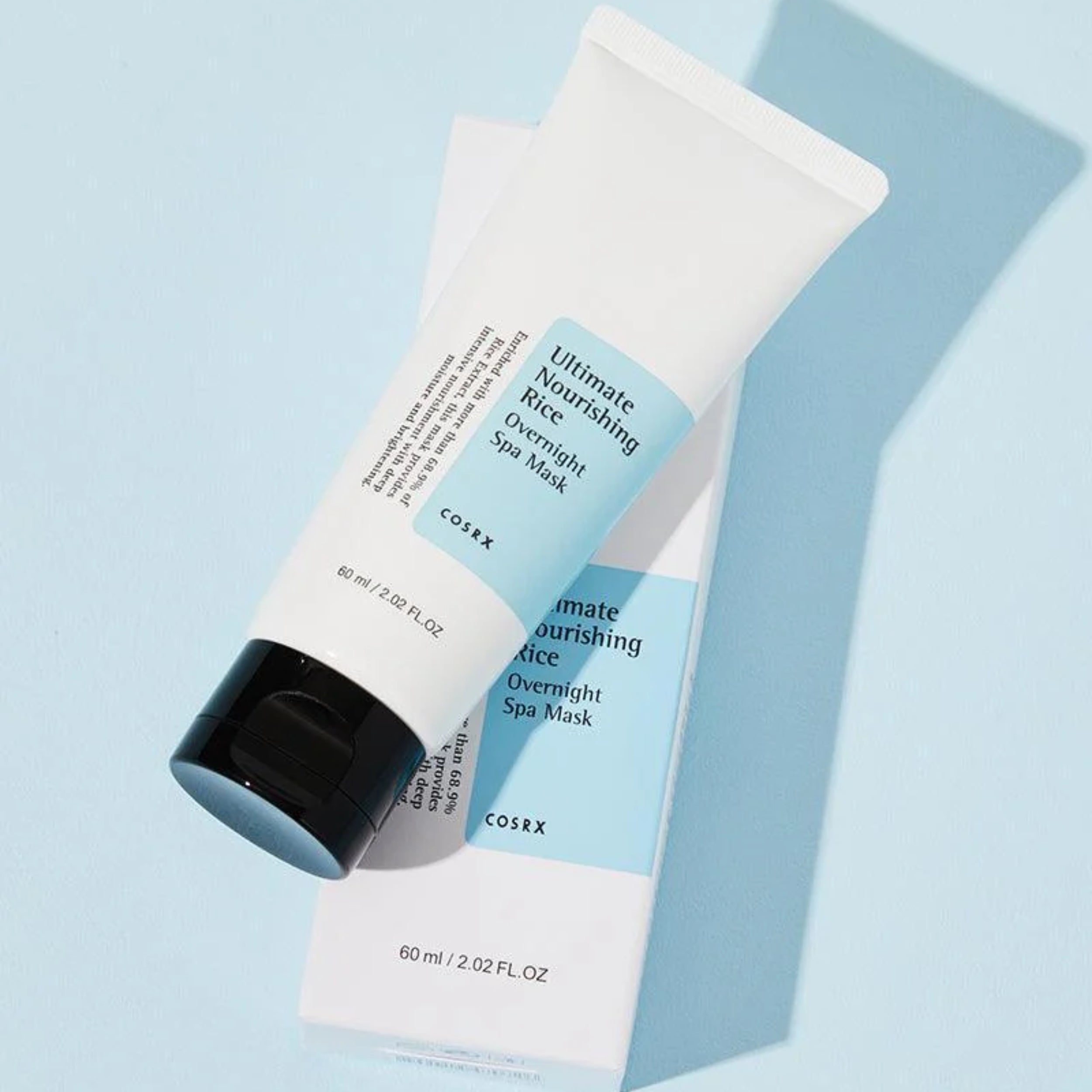 Cosrx Ultimate Nourishing Rice Overnight Spa Mask on a light blue background