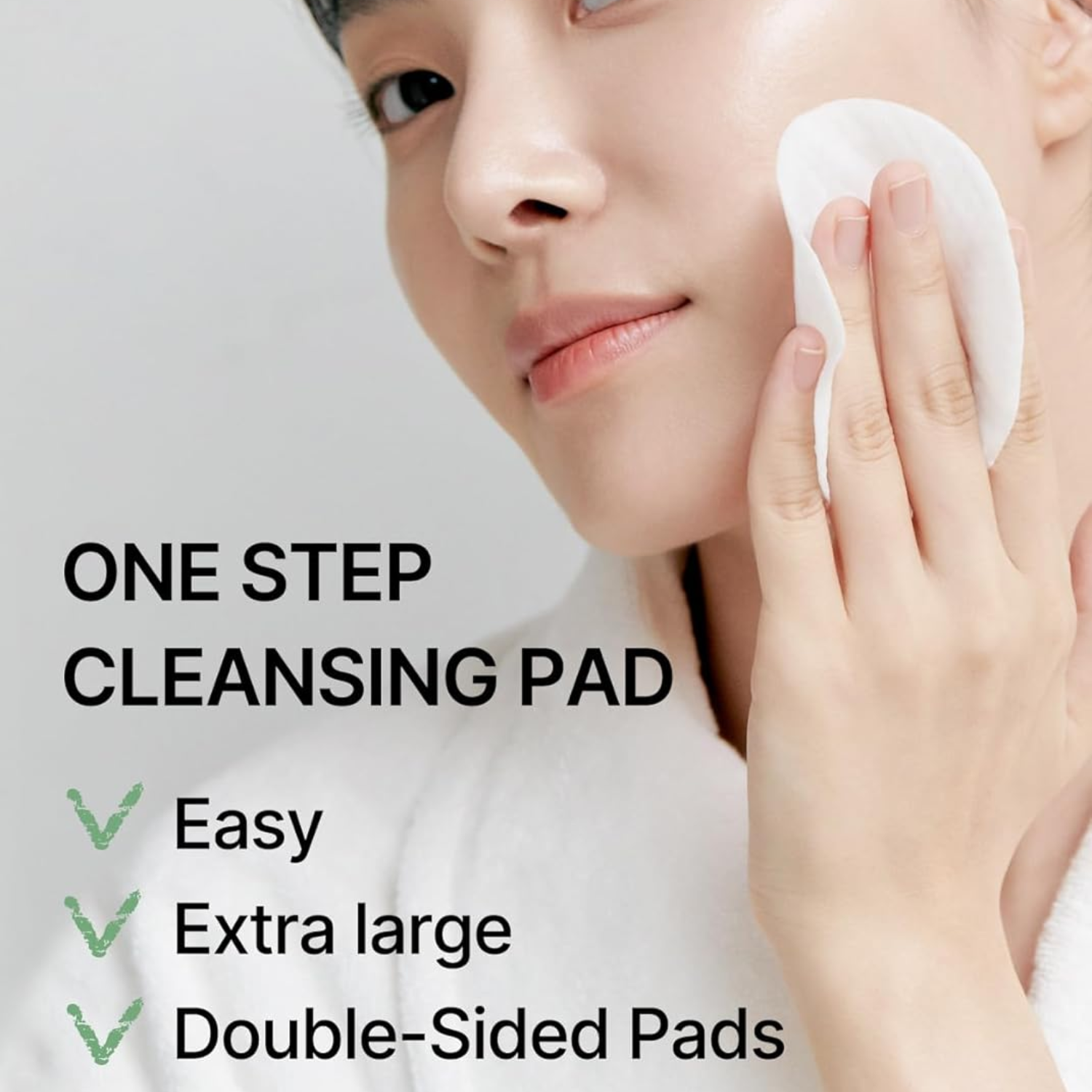 Person using a cleansing pad with text highlighting features on a light gray background