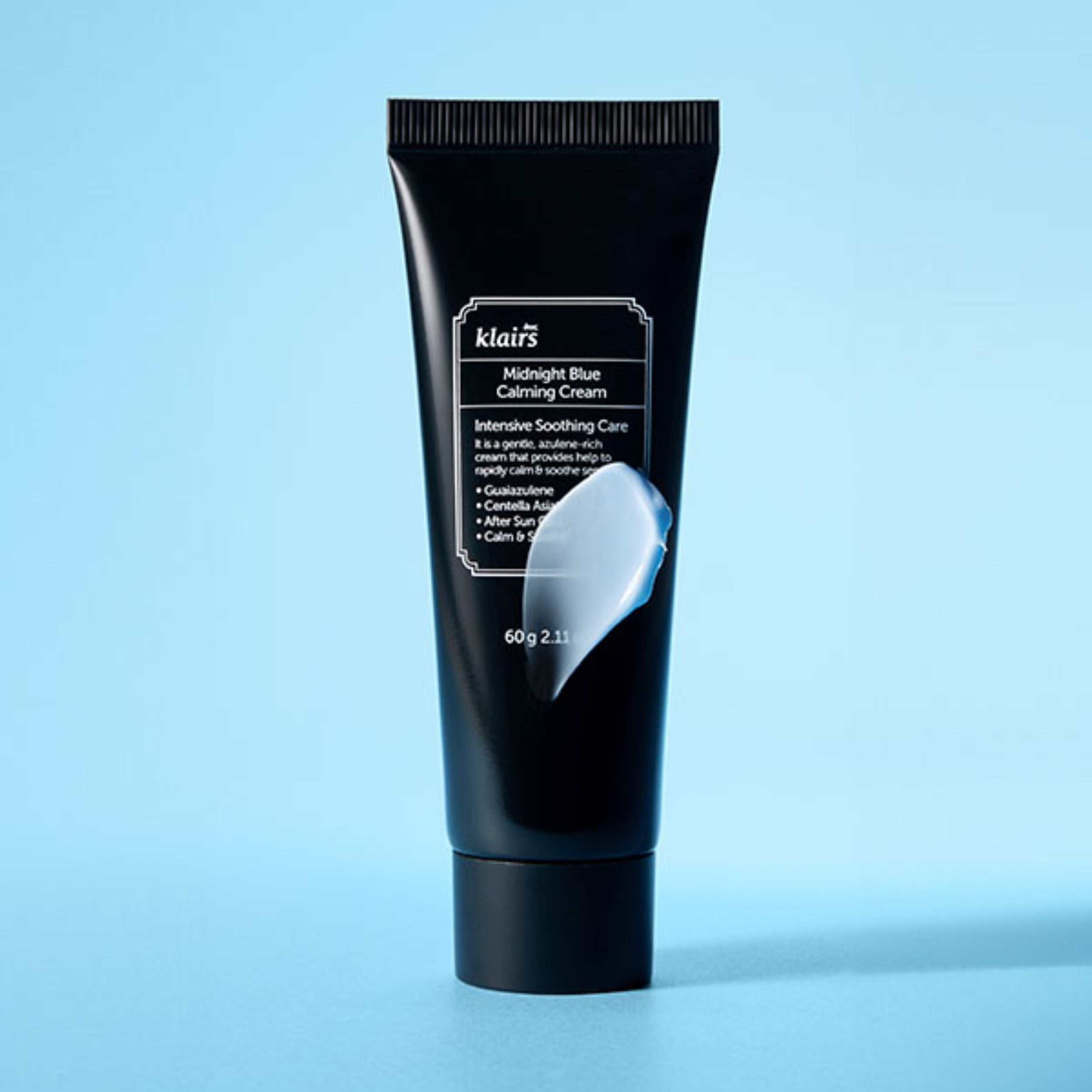 Black tube of Klairs Midnight Blue Calming Cream on a light blue background