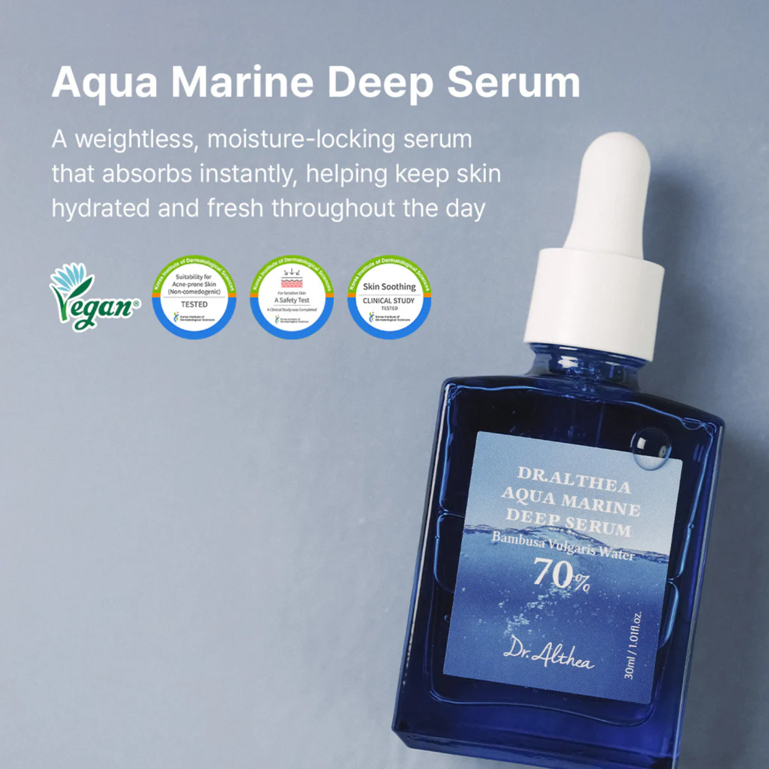 Aqua Marine Deep Serum bottle with dropper on a gray background