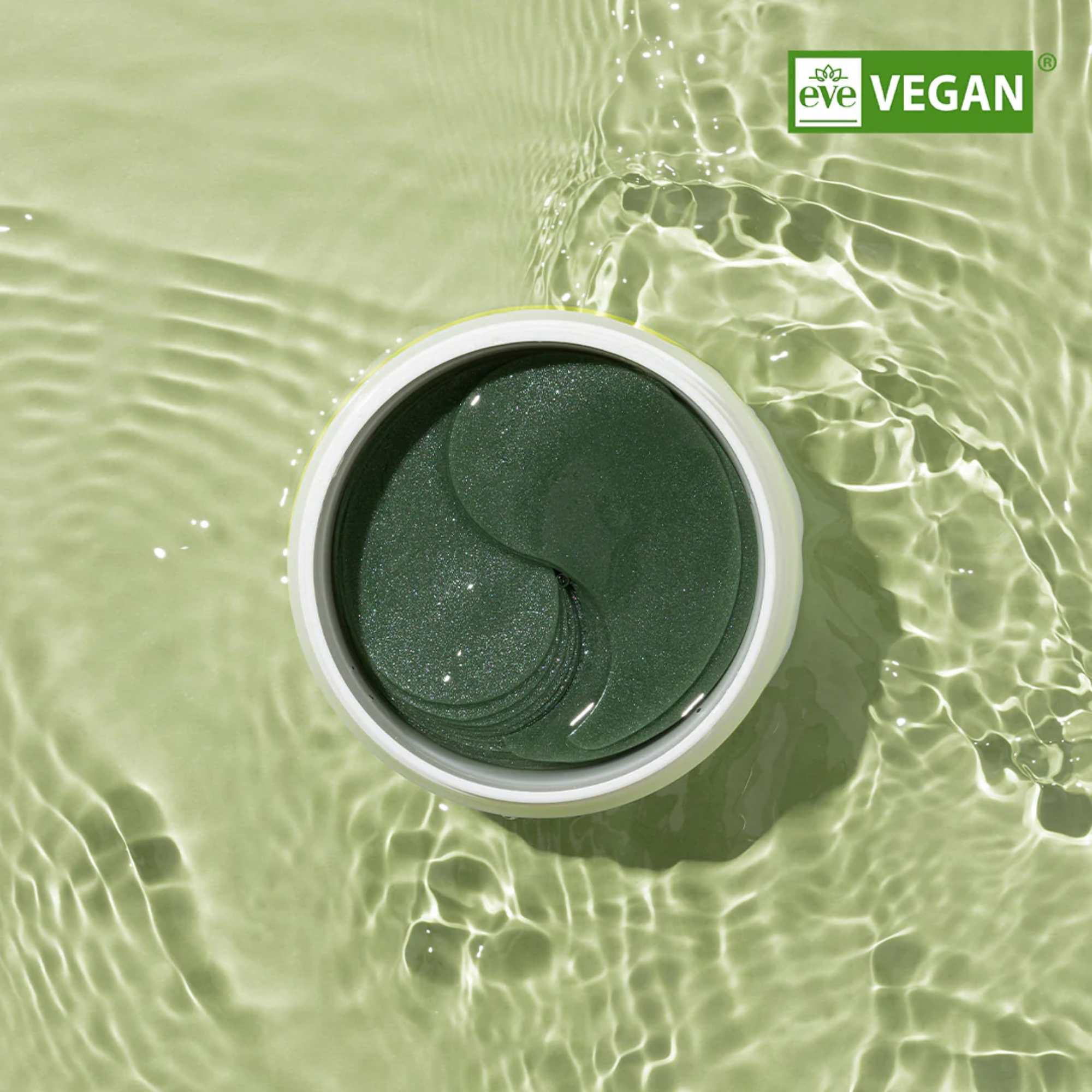 Green container with a yin-yang symbol in water, featuring the 'eve' brand.