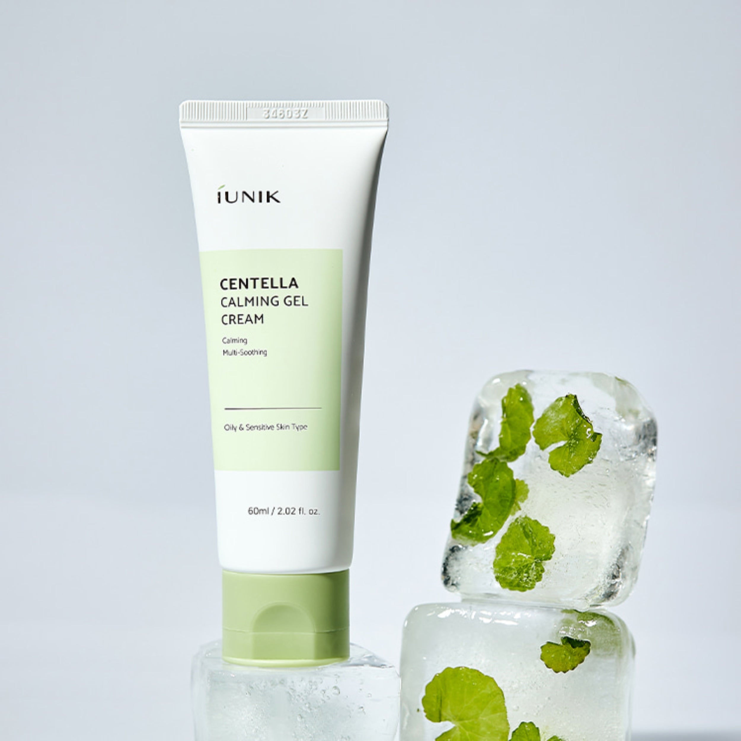 iUNIK Centella Calming Gel Cream with ice cubes and centella asiatica leaves on a light gray background
