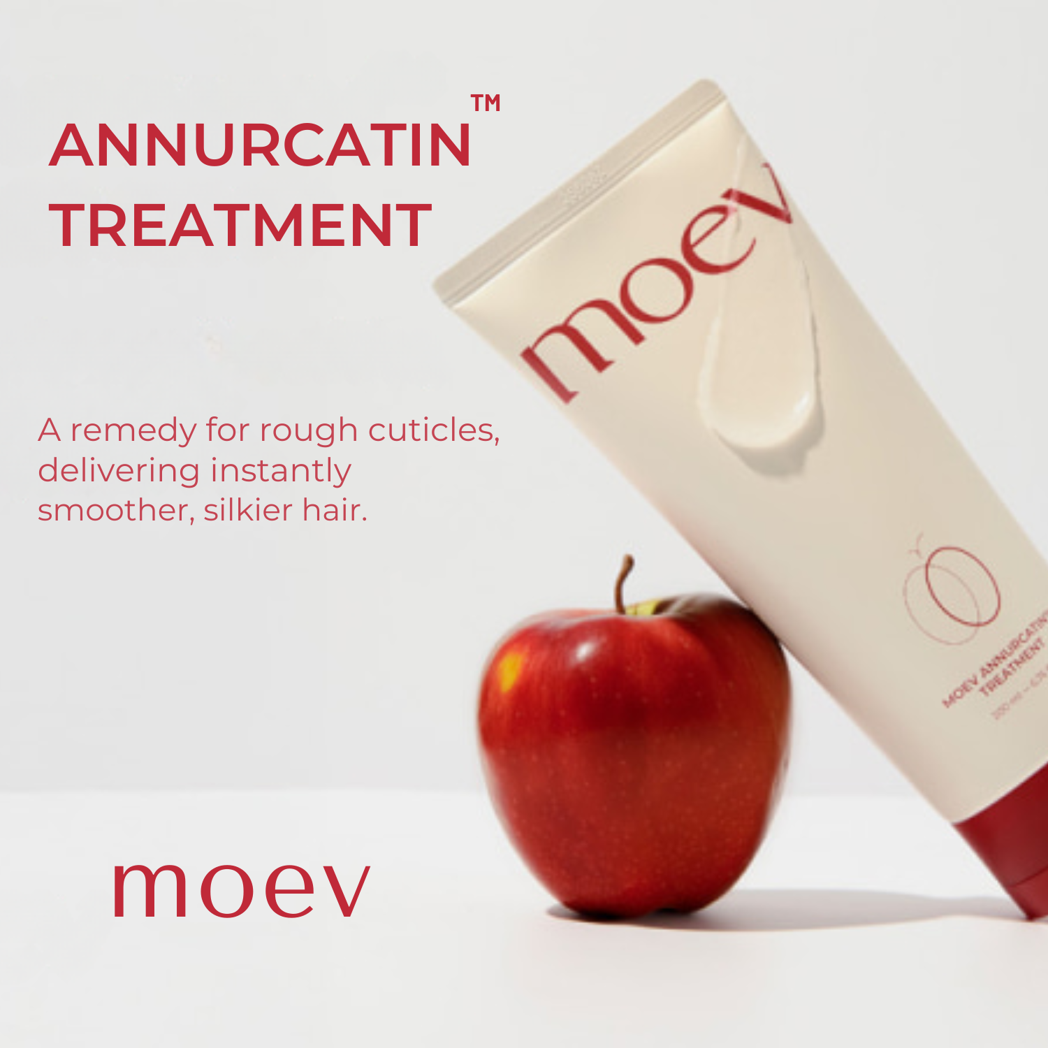 moev hair treatment tube with an apple on a white background