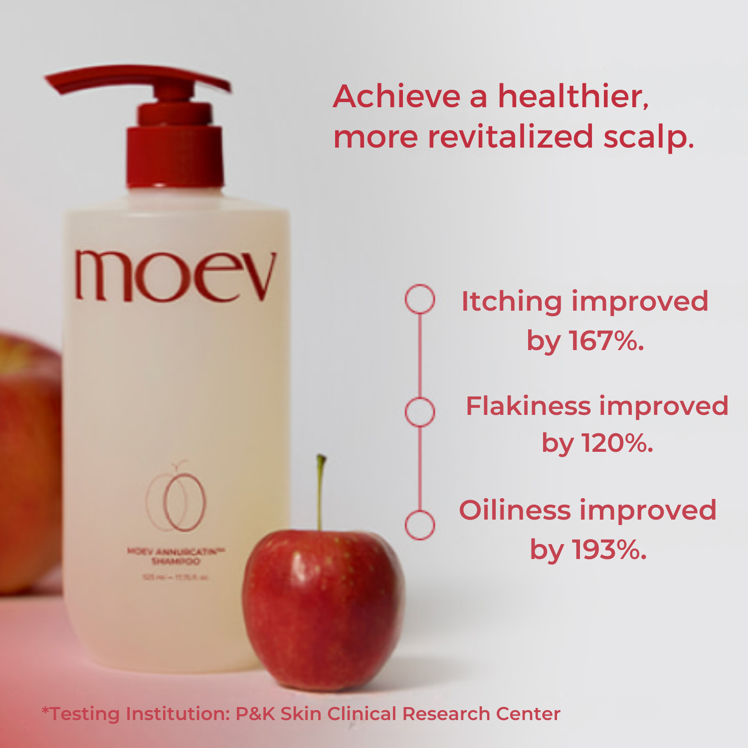 Shampoo bottle labeled 'moev' with apples and text on a light background
