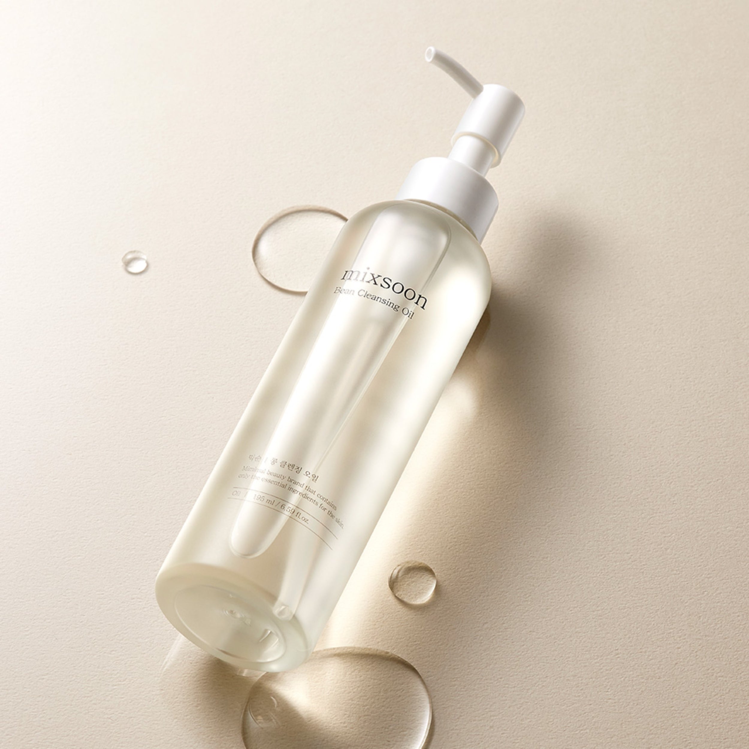 Skincare bottle with pump on a beige background