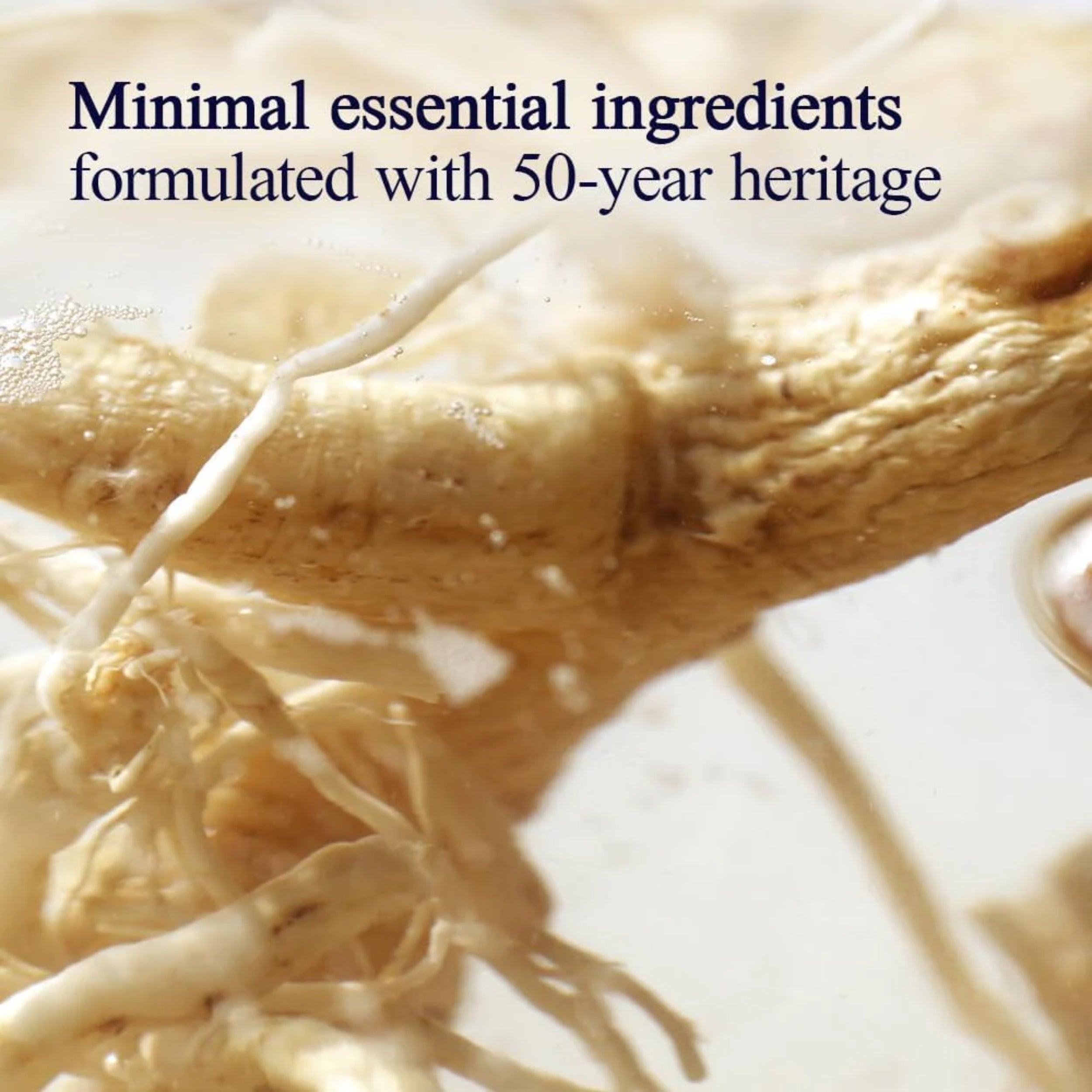 Close-up of a root with text about minimal essential ingredients and 50-year heritage.