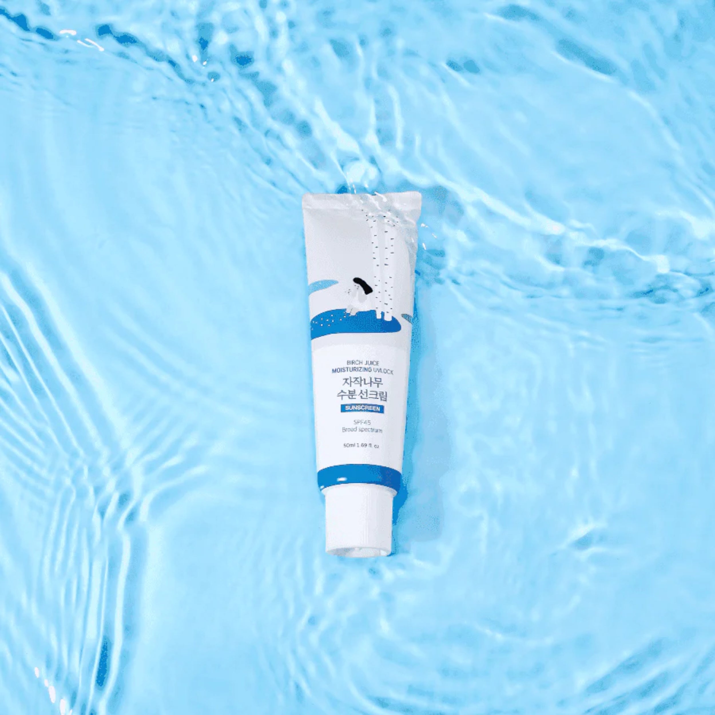 Tube of cream on a blue water background