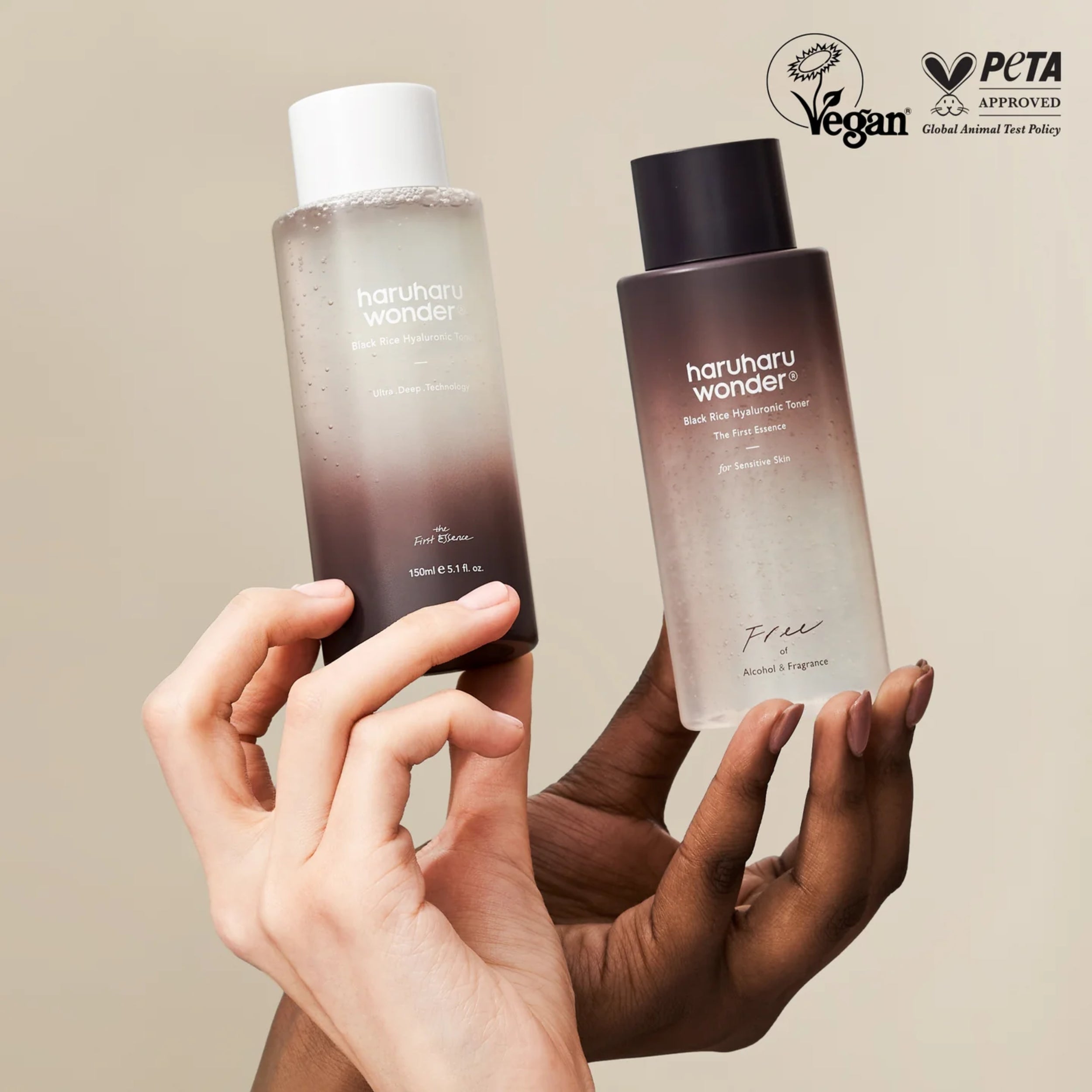 Two bottles of haruharu wonder skincare products held by hands against a beige background