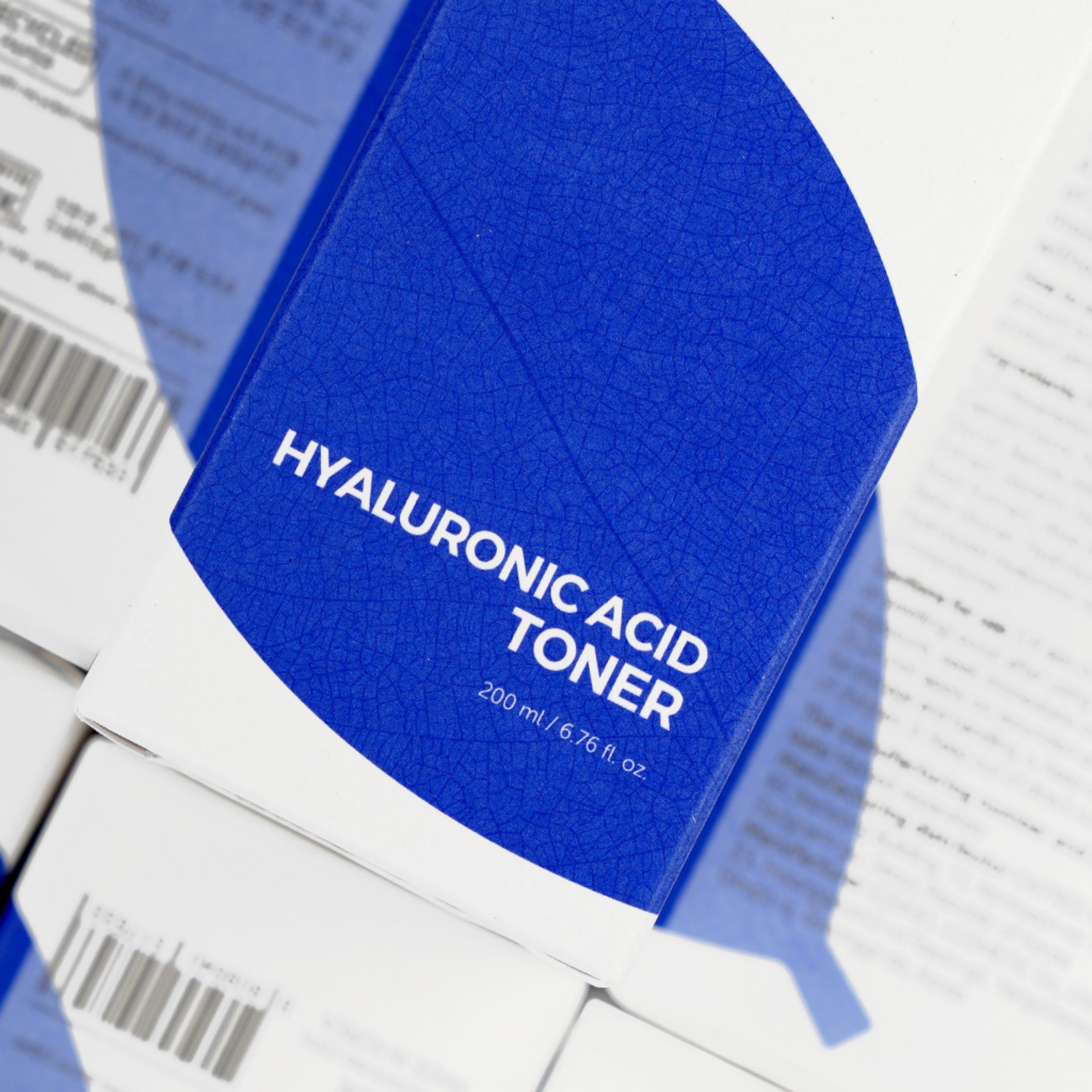 Blue packaging of hyaluronic acid toner on a white background