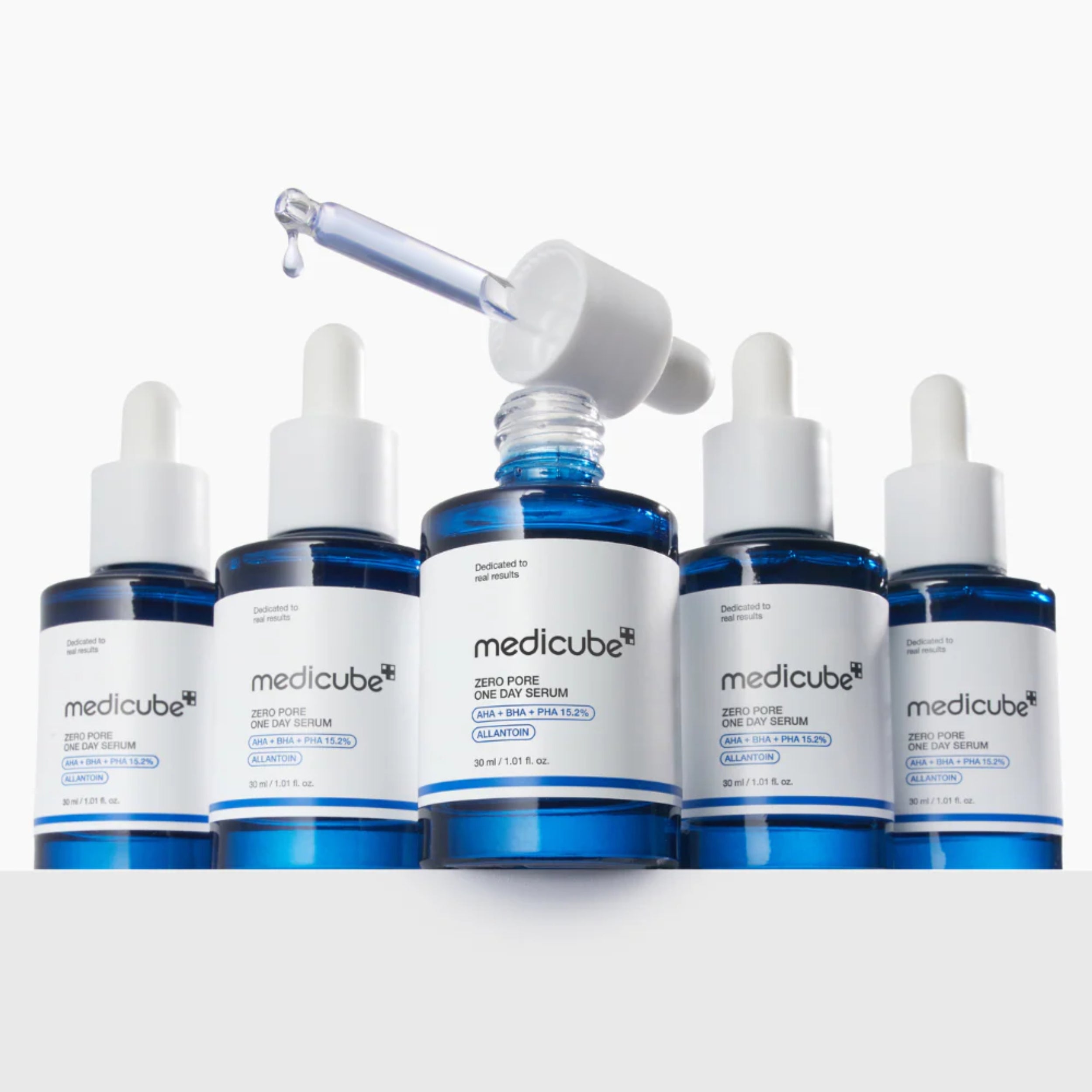 Set of Medicube skincare serum bottles with dropper on a white background
