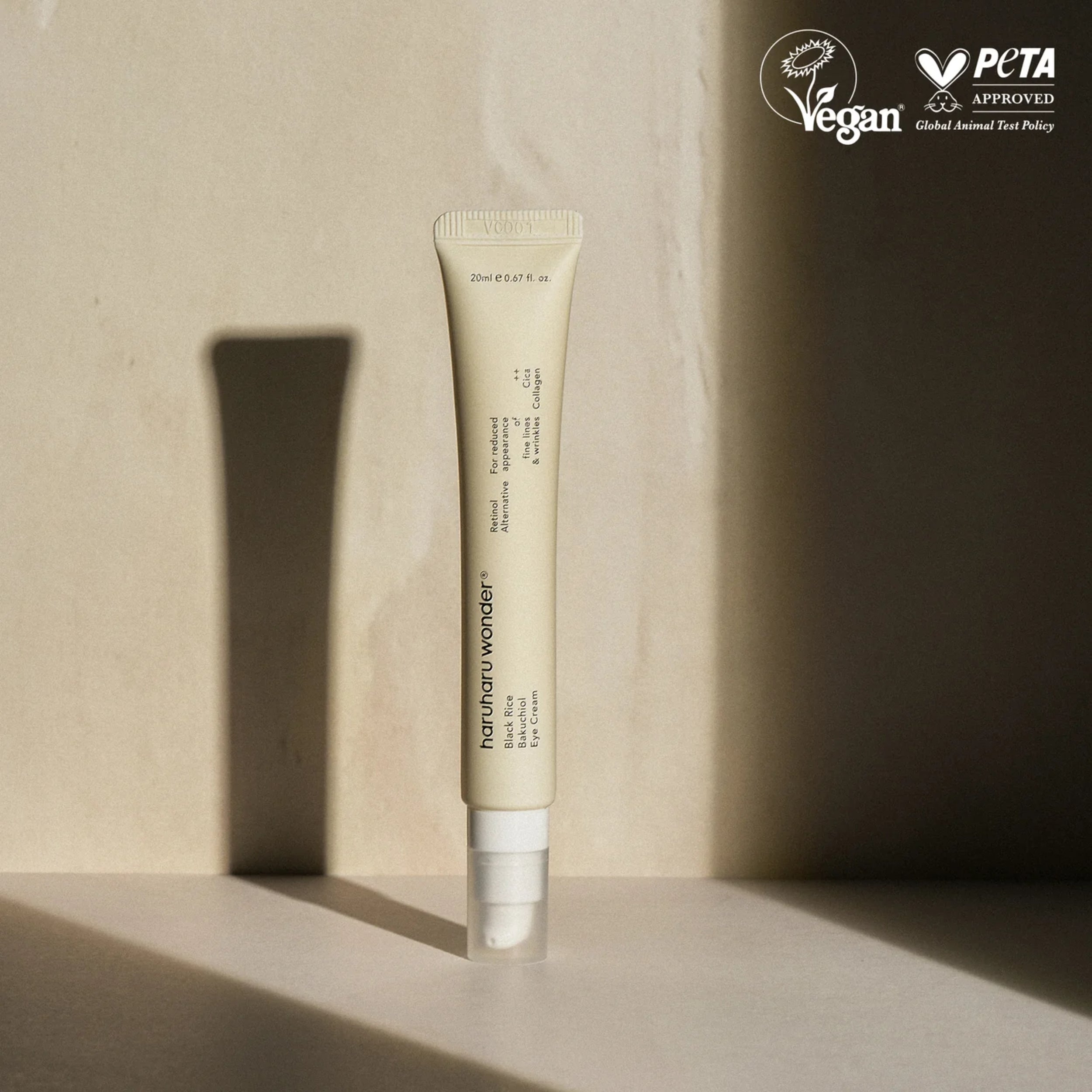 Cosmetic tube on a neutral background with PETA approval logo.