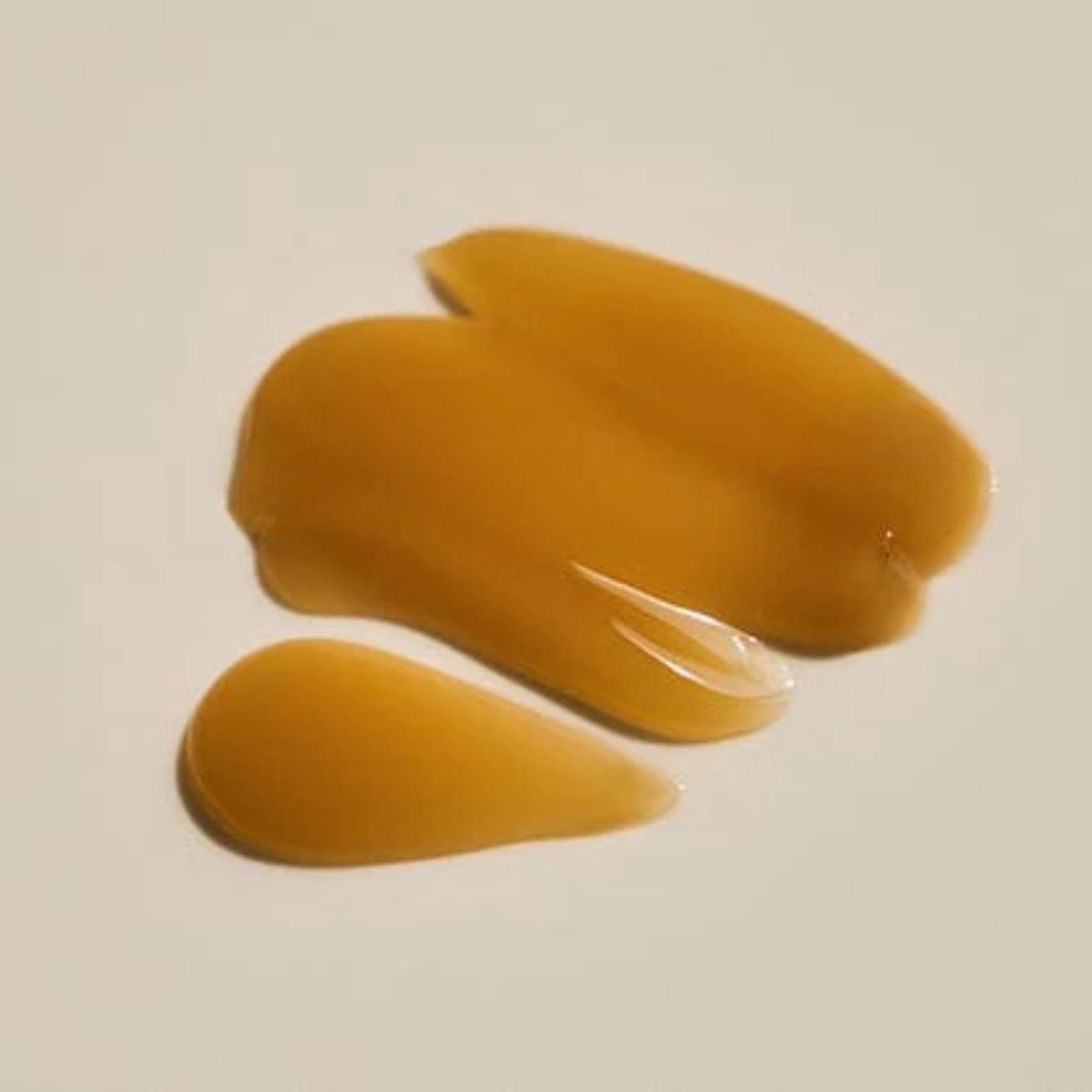 Three yellowish-brown objects on a beige background