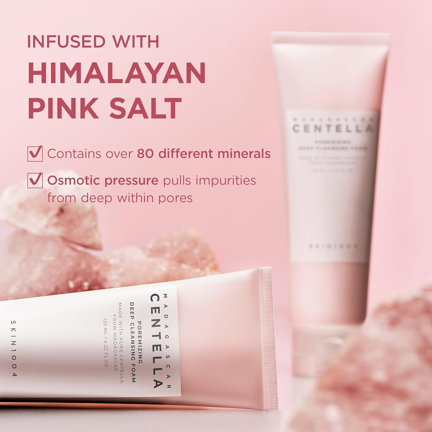 Two skincare products with Himalayan pink salt text on a pink background