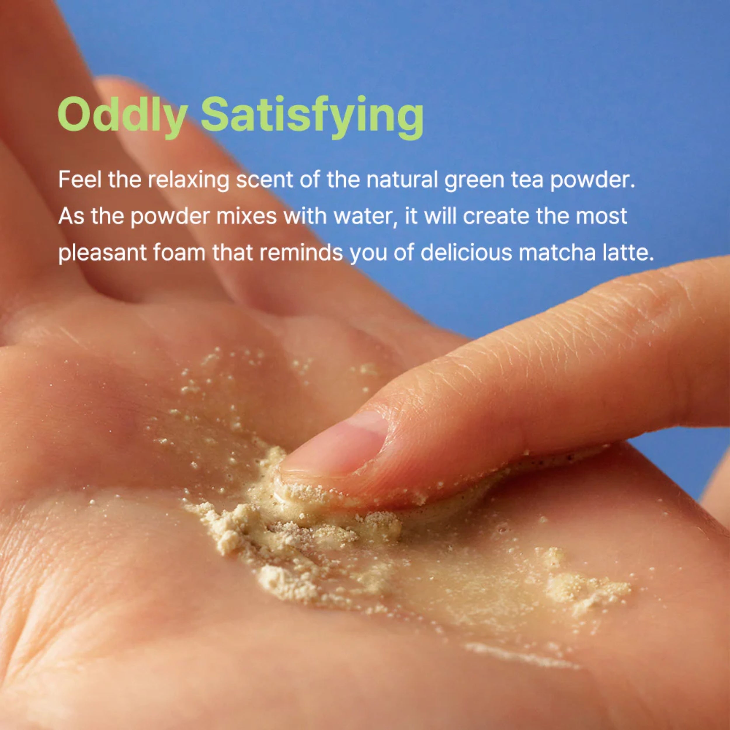 Hand holding green tea powder with text about its properties