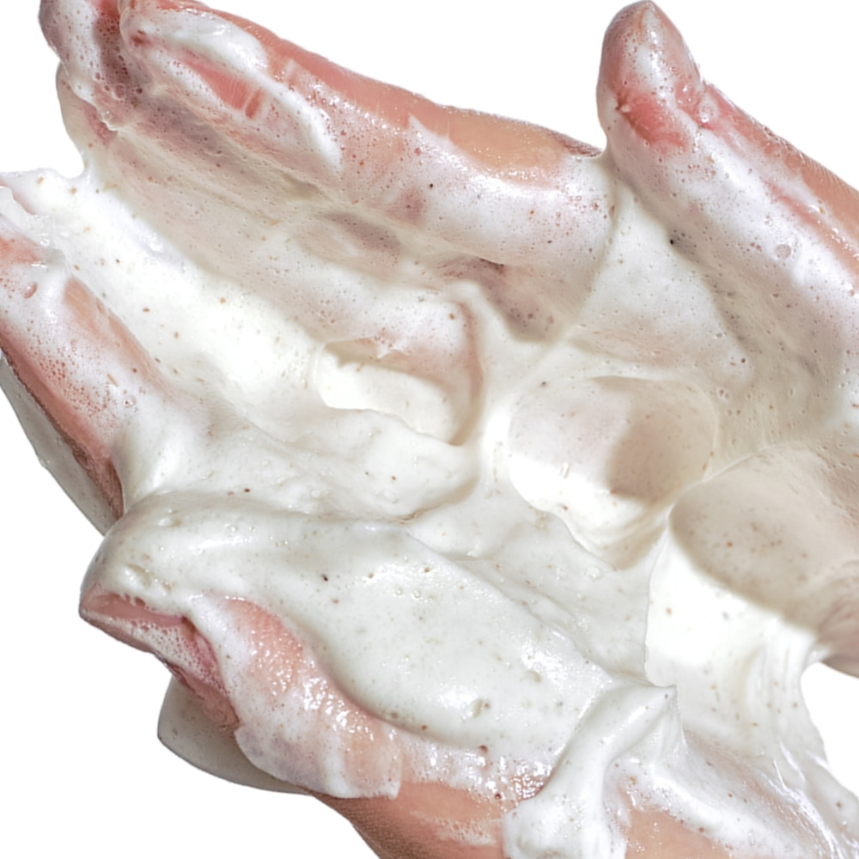 Close-up of a hand with white cream on a white background