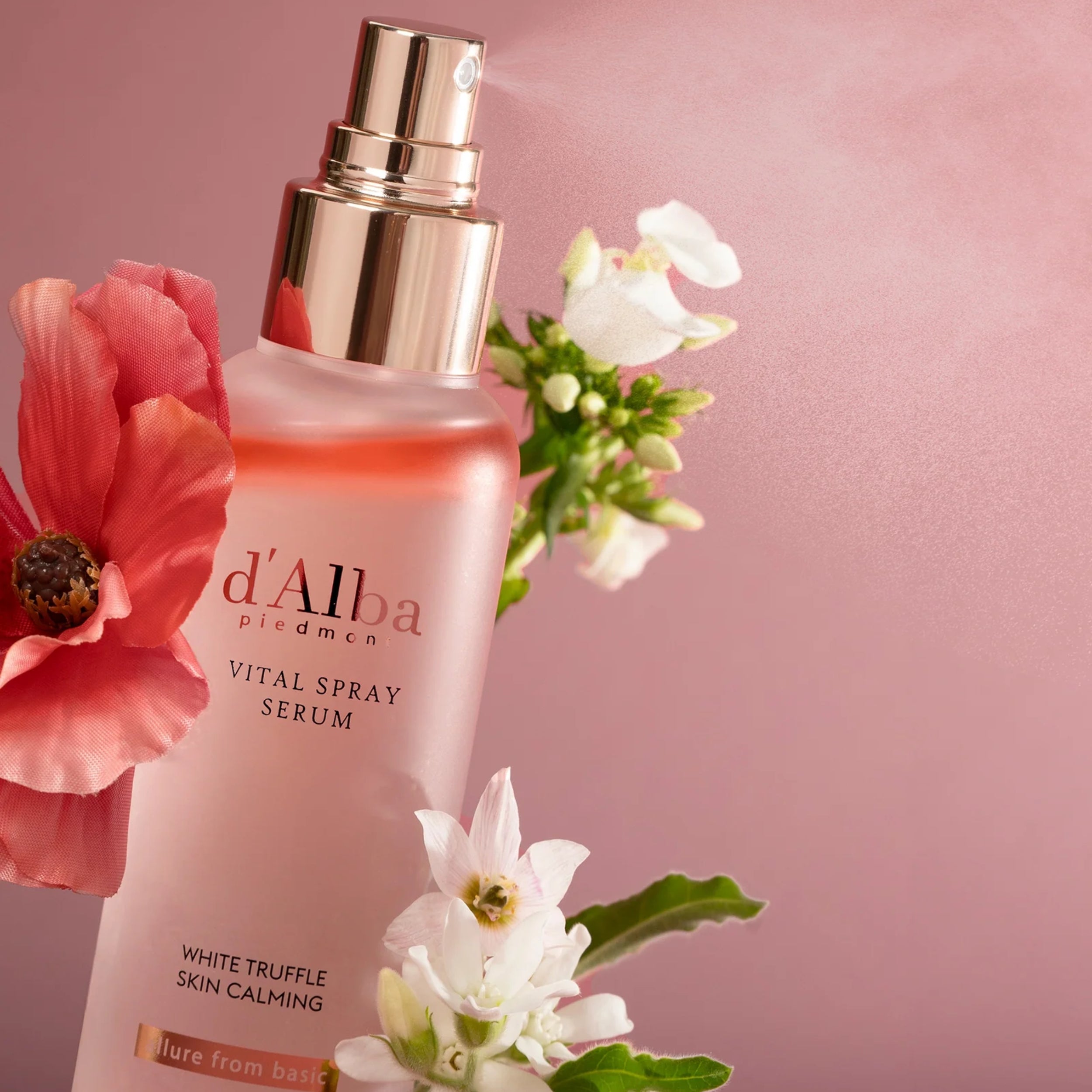 d'Alba vital spray serum with flowers on a pink background