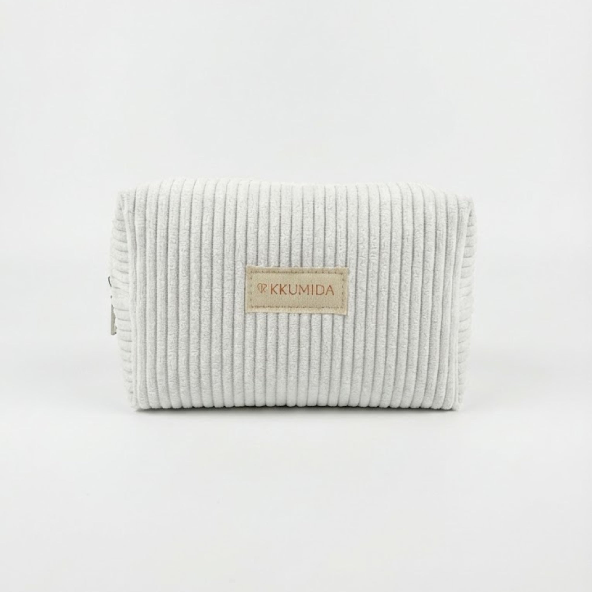 Textured clutch bag with a brand label on a white background