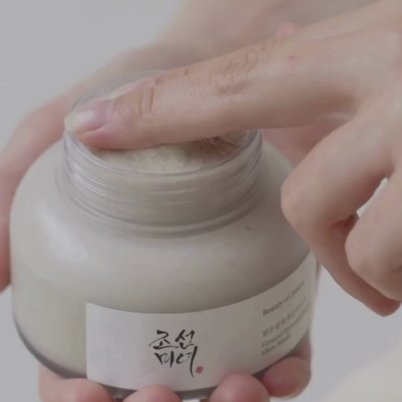 holding a jar of beauty of joseon ground rice and honey glow mask
