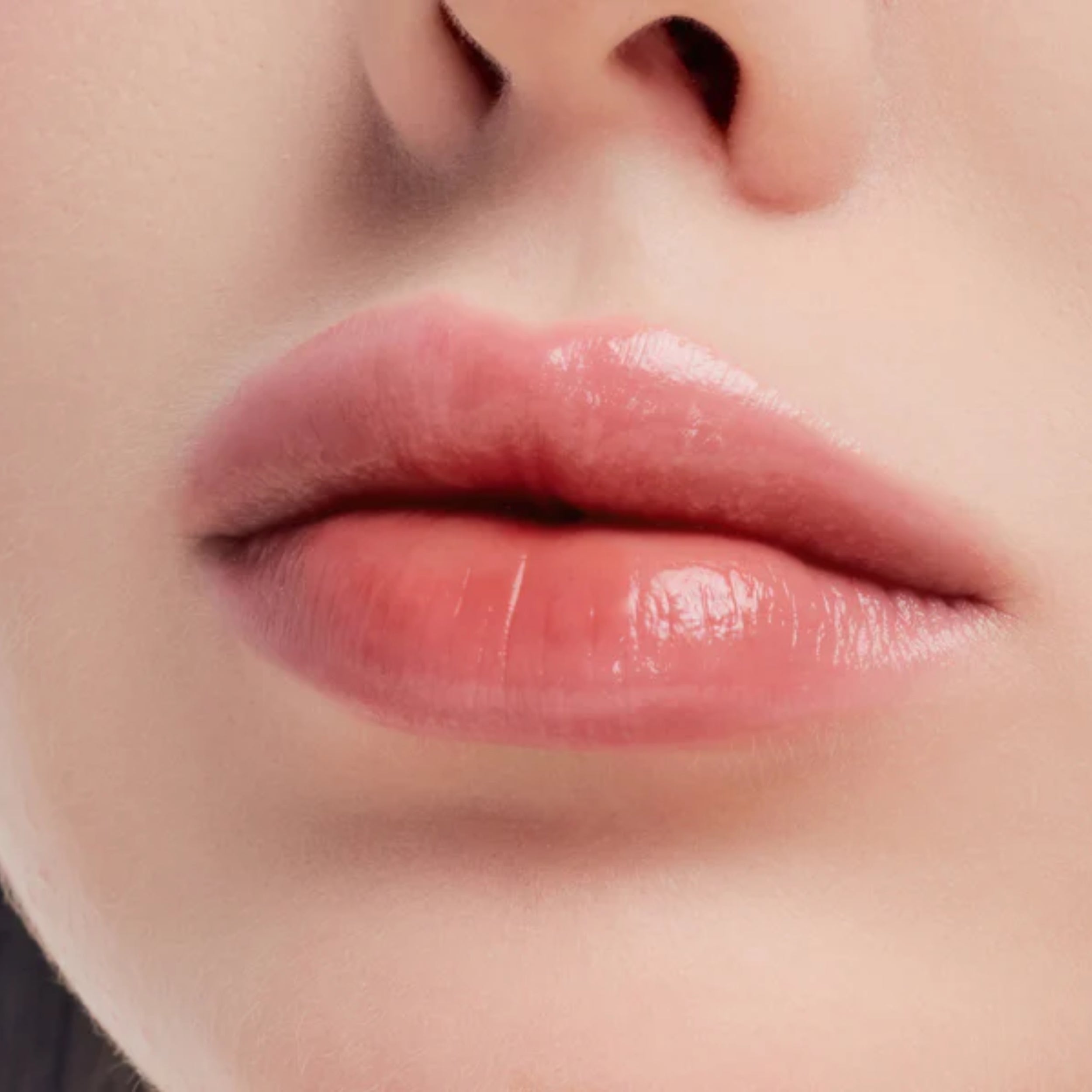 Close-up of a person's lips with a soft focus on the skin around.